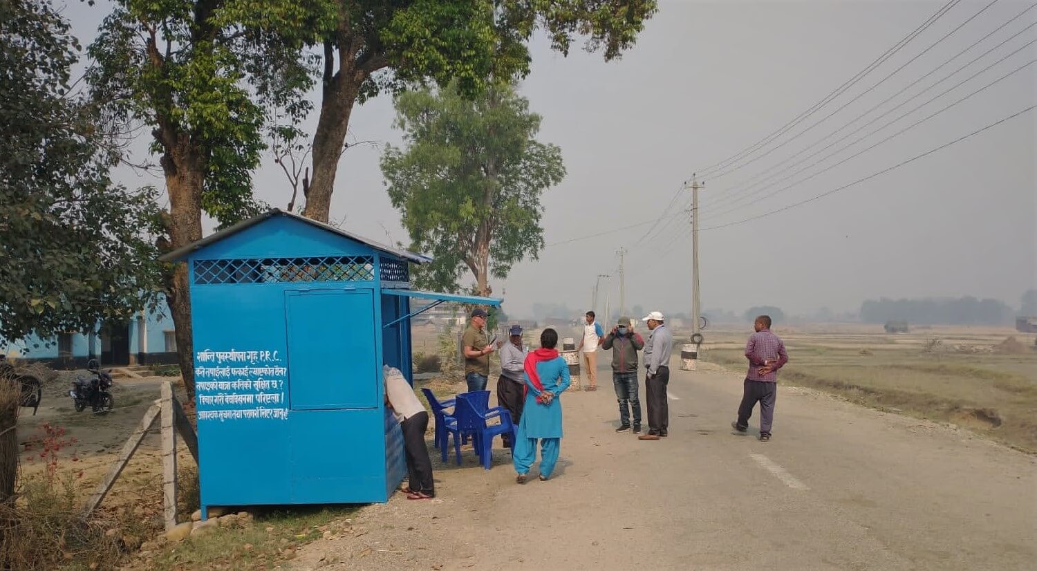 Our border agent stands at a border station in Nepal.