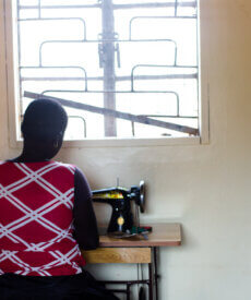 Girls in Uganda working diligently at sewing