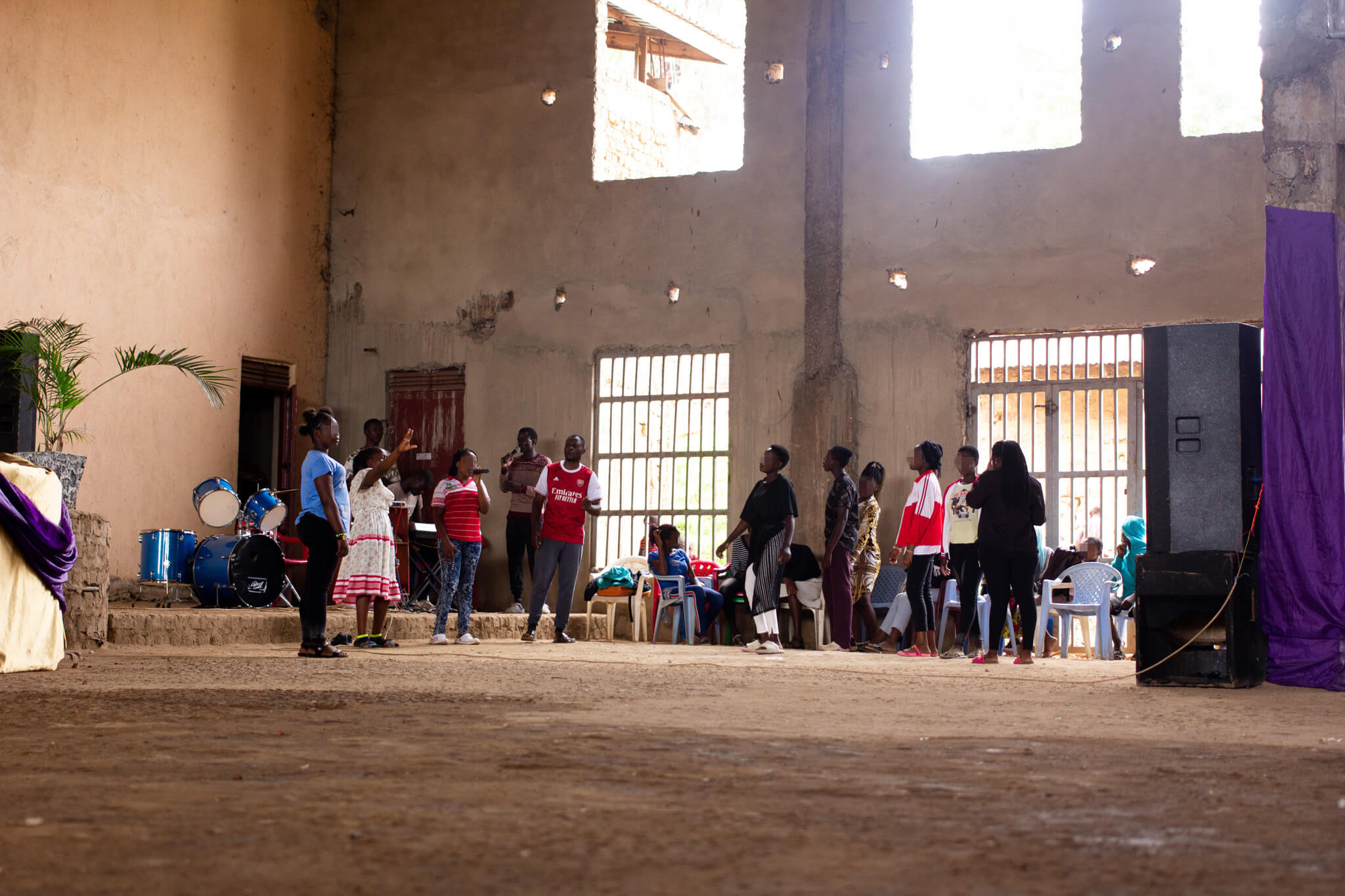 Victory (white dress) at choir practice