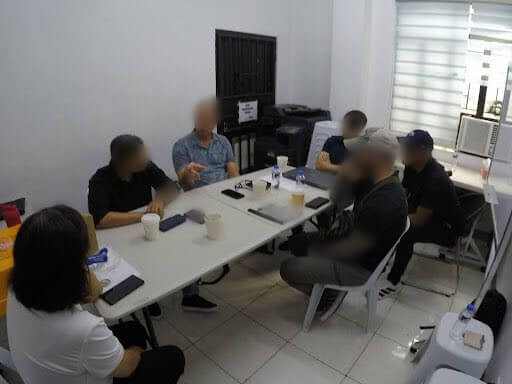 Destiny Rescue, PNP and FBI agents meet for a pre-raid briefing