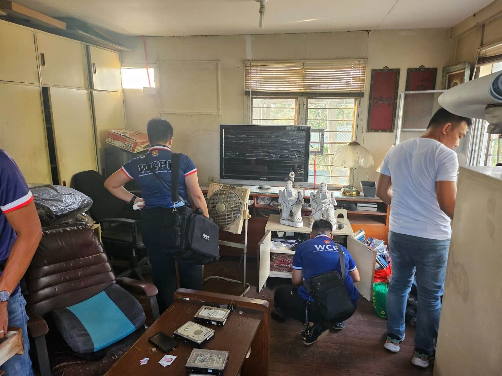 Law enforcement officers combed the residence for evidence