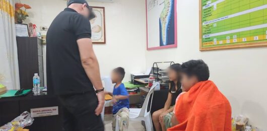 Caleb talks with the children after they are safely in the care of the government shelter